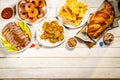 Selection of traditional hanukkah food for festive dinner, wood background