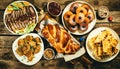 Selection of traditional hanukkah food for festive dinner, wood background