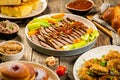 Selection of traditional hanukkah food for festive dinner, wood background