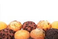 Selection of various muffin cakes lower border white background