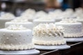 Selection of white wedding cakes at wedding fair or pastry shop Royalty Free Stock Photo