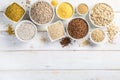 Selection of whole grains in white bowls - rice, oats, buckwheat, bulgur, porridge, barley, quinoa, amaranth, Royalty Free Stock Photo
