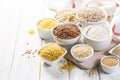 Selection of whole grains in white bowls - rice, oats, buckwheat, bulgur, porridge, barley, quinoa, amaranth, Royalty Free Stock Photo