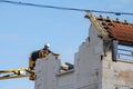 Selective blur on a construction worker, a demolition worker ready to demolish a residential house in France, in Arcachon. Royalty Free Stock Photo