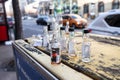 Selective blur on empty miniature alcohol bottles scattered in a street of budapest after a hunge binge drinking party Royalty Free Stock Photo