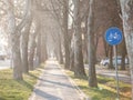 Selective blur on a european blue roadsign indicating the presence of a bicycle lane that is mandatory to be used by cyclists