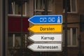 Selective blur on a german roadsign in Essen, Germany, indicating directions to the autobahn motorway and local smaller villages