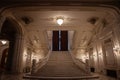 Selective blur on a giant marble steps and stairway with opulent design of a hall in the interior of the Romanian palace of