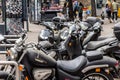 Selective blur on a group of Motorcycles and Scooters, boosters and motorbikes, parked in the city center of Belgrade on a parking Royalty Free Stock Photo