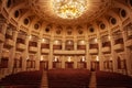 Selective blur on the interior of an opera house, a point of view POV from the stage, looking at the public seats, with nobody, in
