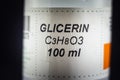 Selective blur on the label of a Plastic Bottle of C3H8O3 Glycerin, medical glycerol, used for wound treatment in healthcare