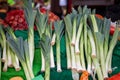 Selective blur on leeks salads for sale on Ljubljana Market in Slovenia. Leek is also called allium ampeloprasum