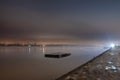 Selective blur on a long exposure of a small pier anchored standing on the riverbanks of the river Danube on Zemunski Kej, in