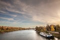 Selective blur on the Maastricht Waterfront on the Meuse Maas river with a focus on the hoge brug bridge, in autumn, during a Royalty Free Stock Photo