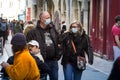 Selective blur on a man & woman, couple, lovers, with facemask, twalking in a street in Bordeaux during coronavirus covid 19