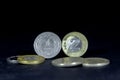 Selective blur on a one and two zloty coins, old with the mentions 1 and 2 Zloty in polish, isolated on a black background. PLN, Royalty Free Stock Photo