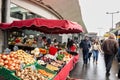 Selective blur on people, clients, buying groceries in crowd in Bordeaux, in Marche des Capucins, one of the main green farmers