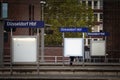 Selective blur on a sign indicating Dusseldorf Hbf, or Dusseldorf Hauptbahnhof, meaning in German Dusseldorf Main train station,