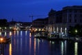 Selective blur on vaporetto ferryboats at night on the grand canal, the main lagoon channel river and a major touristic landmark