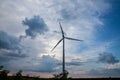 Selective blur on a windmills in the fields of Voivodina, in Serbia, during a sunny night, at dusk. Royalty Free Stock Photo