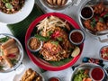 selective choice food table Shell Crab noodle, Chicken Satay, Spring Roll, Curry Samosa, fish cake, Folks Drumlet, Pork Jar Salad Royalty Free Stock Photo