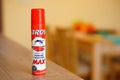 Selective closeup of Bros Max protection insect spray bottle on a table