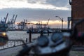 Selective of cranes and ships on a harbor on the sunset Royalty Free Stock Photo