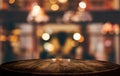 Selective Empty wooden table in front of abstract blurred festive light background with light spots and bokeh for product montage Royalty Free Stock Photo