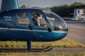 Selective of a flight instructor with a student learning to fly a Robinson R44 helicopter Royalty Free Stock Photo