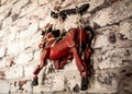 Wooden String Puppet Horse hanging on a wall Royalty Free Stock Photo