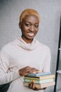 Selective focus of african american woman holding books Royalty Free Stock Photo