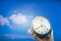 Selective focus of alarm clock with blue sky Royalty Free Stock Photo