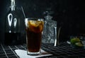 selective focus, alcoholic whiskey cocktail with Cola and lime