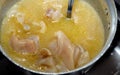 Arabic Egyptian cuisine of kawareh soup ( trotters soup ) , cooked cow feet in a cooking pot