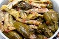 Arabic Egyptian traditional cuisine of Mahshi or stuffed grape leaves, wrapped cabbage and stuffed bell peppers