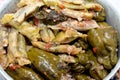 Selective focus of Arabic Egyptian traditional cuisine of Mahshi or stuffed grape leaves, wrapped cabbage and stuffed bell peppers