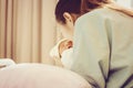 Selective focus of asian mother kissing newborn baby boy sleeping in hand at hospital Royalty Free Stock Photo