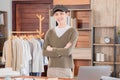 Selective focus of asian young man smiling asian wear hat stand confident small business entrepreneur fashion designer at Royalty Free Stock Photo