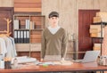 Selective focus of asian young man smiling asian wear hat stand confident small business entrepreneur fashion designer at Royalty Free Stock Photo