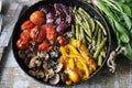 Selective focus. Baked vegetables in a pan. Healthy bright food. Cooking at home. Vegan diet. Royalty Free Stock Photo