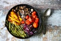 Selective focus. Baked vegetables in a pan. Healthy bright food. Cooking at home. Vegan diet. Royalty Free Stock Photo