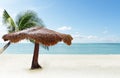 Selective focus beach chairs with umbrella wood and beautiful sand beach with coconut tree and andaman sea background tropical