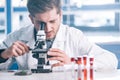 selective focus of bearded biochemist looking Royalty Free Stock Photo