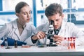 selective focus of biochemist looking through Royalty Free Stock Photo