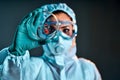 Selective focus of biochemist taking biomaterial from petri dish with tweezers Royalty Free Stock Photo