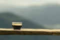 selective focus black coffee americano in a clear glass placed on a wooden balcony high angle nature background There is space for Royalty Free Stock Photo