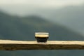 selective focus black coffee americano in a clear glass placed on a wooden balcony high angle nature background There is space for Royalty Free Stock Photo