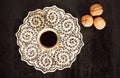 Selective focus with black and white kitchen tray, walnuts and cup of coffee Royalty Free Stock Photo