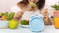 Selective focus of Blue clock which Time to eat. Healthy lifestyle diet and Intermittent fasting program for diet plan Royalty Free Stock Photo