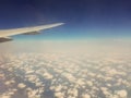 Selective focus blue sky and clouds from airplane window. Royalty Free Stock Photo